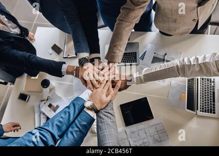 employees supporting each other, top view photo. likeminded people Stock Photo