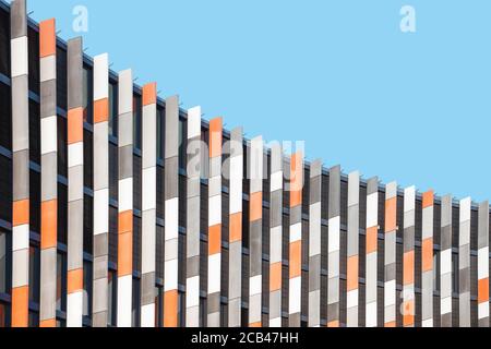 Colorful detail of modern building facade against blue sky. Abstract geometric architectural background Stock Photo