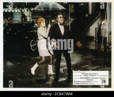 SHIRLEY MacLAINE and RICARDO MONTALBAN in SWEET CHARITY 1969 director / choreographer BOB FOSSE writers Neil Simon Peter Stone Federico Fellini music Cy Coleman lyrics Dorothy Fields costumes Edith Head Universal Pictures Stock Photo