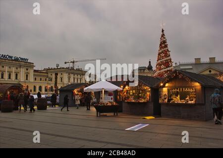 Krakow, Poland - November 30, 2014: A view of gift and souvenir shops before christmas tree Stock Photo