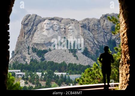 Man Running through a Tunnel viewing Mount Rushmore on the Needles Highway in South Dakota Stock Photo