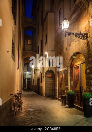 Small empty street in Florence, Italy at night Stock Photo