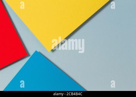 Abstract color papers geometry flat lay composition background with blue, yellow and red color tones Stock Photo