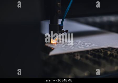 Automated self working laser cutting machine during progress. Stock Photo