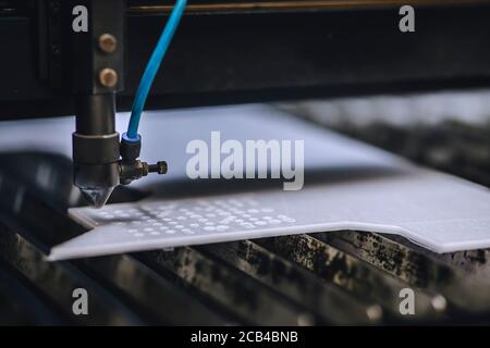 Automated self working laser cutting machine during progress. Stock Photo