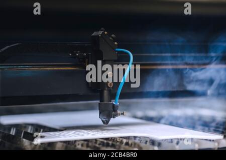 Automated self working laser cutting machine during progress. Stock Photo
