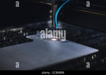 Automated self working laser cutting machine during progress. Stock Photo