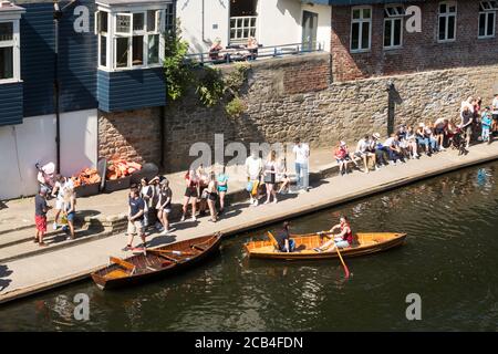 People queuing to hire Browns rowing boats on the river in  Durham City, Co. Durham, England, UK Stock Photo