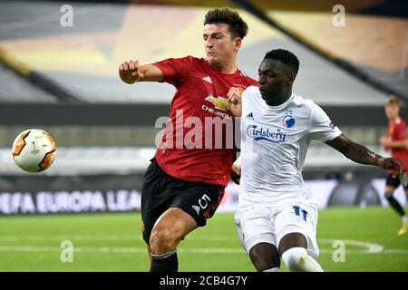 Manchester United's Harry Maguire (left) and FC Copenhagen's Mohamed Daramy battle for the ball during the UEFA Europa League, Quarter Final match at the Stadion Koln, Cologne. Stock Photo