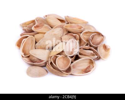Heap of empty pistachios shells isolated on white background Stock Photo