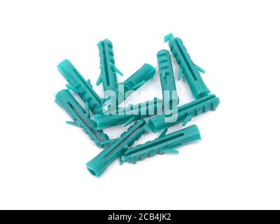 Heap of plastic dowels isolated on white background Stock Photo