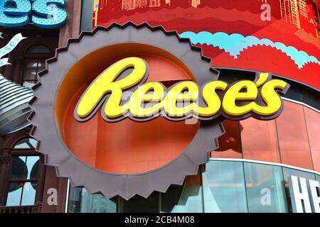 LAS VEGAS, USA - MARCH 22, 2018 : Reese's logo at the entrance of Hershey's Chocolate World. New York New York hotel and casino facade. Stock Photo