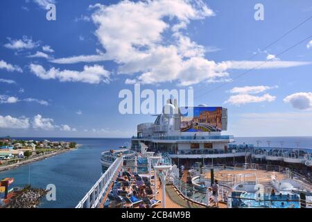 ROSEAU, DOMINICA, CARIBBEAN - MARCH 24, 2017 : Royal Princess ship docked in Roseau port. View from poool deck. Royal Princess is operated by Princess Stock Photo