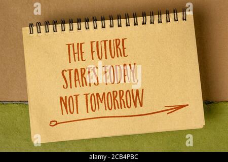 The future starts today, not tomorrow - inspirational reminder, handwriting in a spiral sketchbook, business or personal development concept Stock Photo