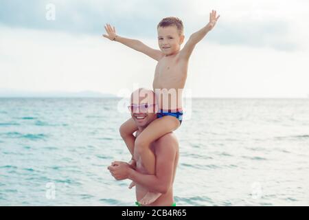 father and son playing in water having a great time Stock Photo