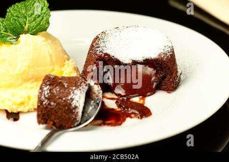 petit gateau of half bitter chocolate with ice cream, Stock Photo