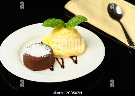 petit gateau of half bitter chocolate with ice cream, Stock Photo