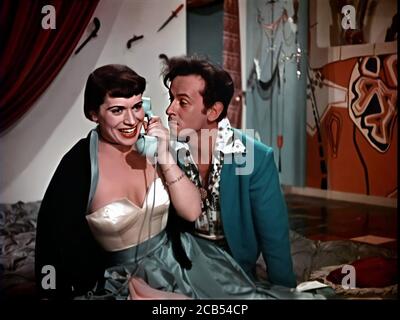 1952 , ITALY : The italian actress FRANCA VALERI ( 1920 - 2020 ) with CARLO MAZZARELLA ( 1919 - 1993 ) in ' Totò a colori ' by Steno , screenplay by Franca Valeri , Steno and Age & Scarpelli , produced by Carlo Ponti and Dino De Laurentiis . The first italian movie completely in color , by FERRANIACOLOR . - FILM - ITALIA - CINEMA   - stop-frame cell - smile - sorriso - phone - telephone - chiamata telefonica conversazione - telefono ---- NOT FOR ADVERTISING USE --- NON PER USO PUBBLICITARIO --- WARNING: This photograph can only be reproduced by publications in conjunction with the promotion of Stock Photo