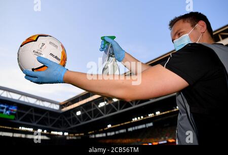 (200811) -- DUSSELDORF, Aug. 11, 2020 (Xinhua) -- The match ball is disinfected prior to the UEFA Europa League quarterfinal between FC Inter and Bayer 04 Leverkusen in Dusseldorf, Germany, Aug. 10, 2020. FOR EDITORIAL USE ONLY. NOT FOR SALE FOR MARKETING OR ADVERTISING CAMPAIGNS. (Stuart Franklin/UEFA/Getty/Handout via Xinhua) Stock Photo