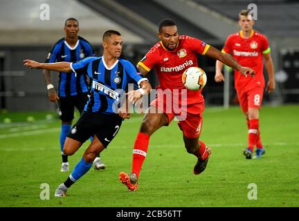 (200811) -- DUSSELDORF, Aug. 11, 2020 (Xinhua) -- Alexis Sanchez (L, front) of FC Inter vies with Jonathan Tah (R, front) of Leverkusen during the UEFA Europa League quarterfinal between FC Inter and Bayer 04 Leverkusen in Dusseldorf, Germany, Aug. 10, 2020. FOR EDITORIAL USE ONLY. NOT FOR SALE FOR MARKETING OR ADVERTISING CAMPAIGNS. (Stuart Franklin/UEFA/Getty/Handout via Xinhua) Stock Photo