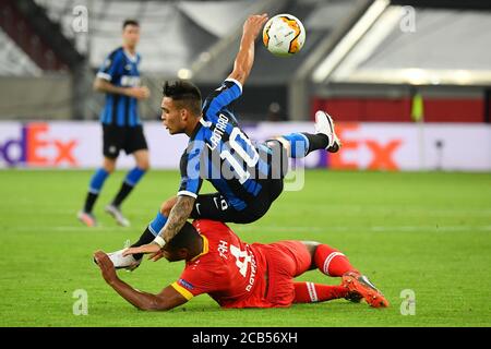 (200811) -- DUSSELDORF, Aug. 11, 2020 (Xinhua) -- Lautaro Martinez (top) of FC Inter vies with Jonathan Tah of Leverkusen during the UEFA Europa League quarterfinal between FC Inter and Bayer 04 Leverkusen in Dusseldorf, Germany, Aug. 10, 2020. FOR EDITORIAL USE ONLY. NOT FOR SALE FOR MARKETING OR ADVERTISING CAMPAIGNS. (Stuart Franklin/UEFA/Getty/Handout via Xinhua) Stock Photo