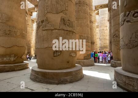A section of the giant columns known as the Hypostyle Hall within the Karnak Temple (Temple of Amun) at Luxor in Egypt. Stock Photo