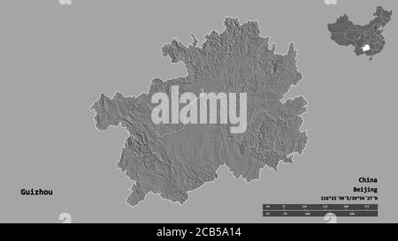 Shape of Guizhou, province of China, with its capital isolated on solid background. Distance scale, region preview and labels. Bilevel elevation map. Stock Photo