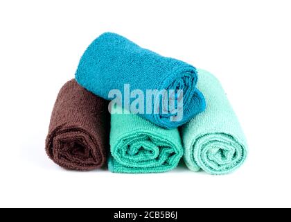 Rolled clean soft towels on white background Stock Photo