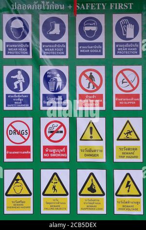 A signboard advertising a signmaker's shop selling warning and prohibition signs in the Thai language; Phuket, Thailand Stock Photo