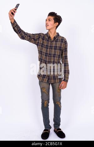Portrait of young handsome Indian teenage boy Stock Photo