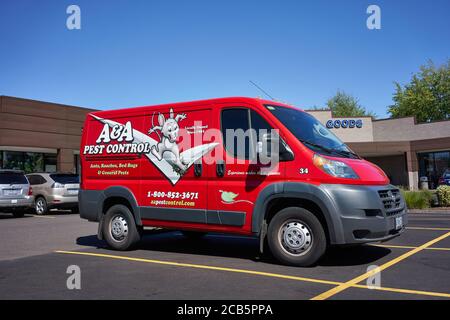 A local pest control company's van is parked outside a Petco store in Tigard, Oregon, on Monday, August 10, 2020. Stock Photo