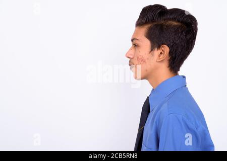 Portrait of young handsome Indian teenage boy as businessman Stock Photo