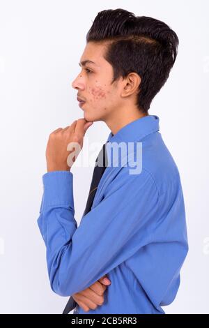 Portrait of young handsome Indian teenage boy as businessman Stock Photo