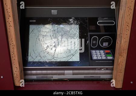 A damaged ATM machine is seen at a Wells Fargo Bank in downtown Portland, Oregon, on Wednesday, August 5, 2020, amid the ongoing BLM protest. Stock Photo