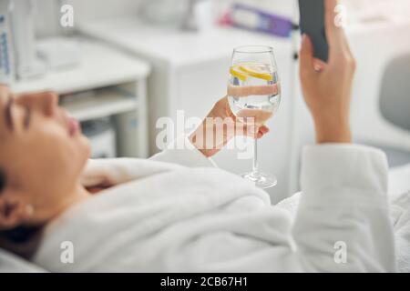 Woman in a bathrobe relaxing in a beauty parlor Stock Photo