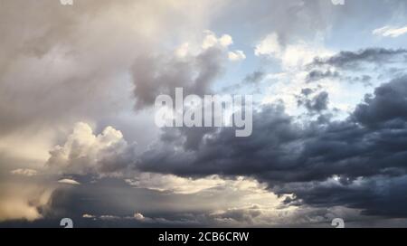 Dramatic cloudscape before the storm at sunset. Stock Photo