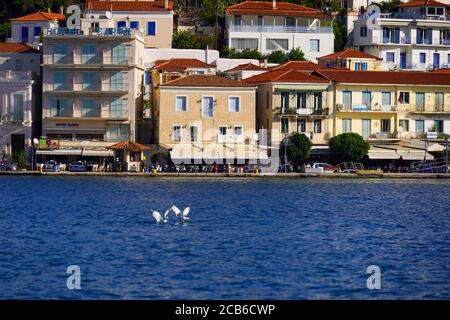 the harbour at Poros is a small Greek island-pair in the southern part of the Saronic Gulf, Greece