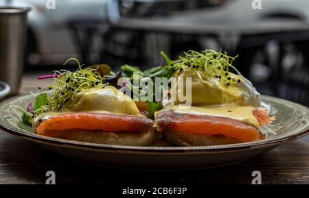 Egg Benedict with smoked salmon and fresh Hollandaise sauce. Stock Photo