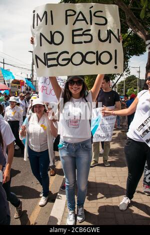 Guatemala City / Guatemala - August 27, 2015 young people from Guatemala with protest posters against the corrupt government demonstrating in the streets Stock Photo