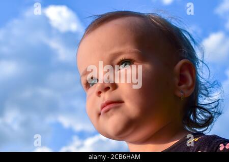 Portrait of a cute little caucasian baby girl with excited facial expression Stock Photo