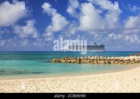 ELEUTHERA, BAHAMAS - FEBRUARY 9, 2014 : View from Eleuthera beach on Crown Princess ship anchored at sea. Stock Photo