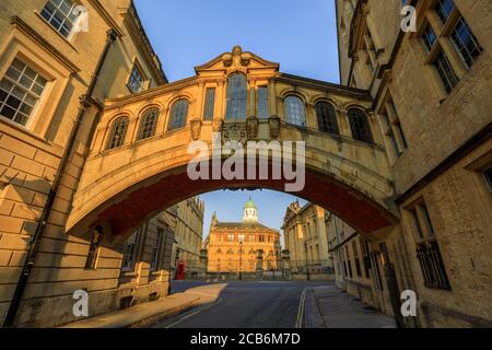 Hertford Bridge, Bridge of Sighs, in Oxford at sunrise with Sheldonian Theatre behind it and no people around, early in the morning on a clear day wit Stock Photo