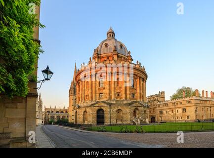 The Radcliffe Camera in Oxford at sunrise with no people around, early in the morning on a clear day with blue sky. Oxford, England, UK. Stock Photo