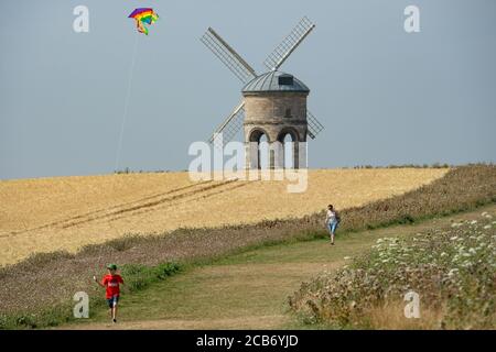 Jack, 10, plays with his kite as he enjoys the hot weather by Chesterton Windmill, Warwickshire. Stock Photo