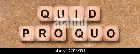 quid pro quo printed on wooden cubes Stock Photo