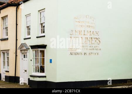 Sign on old Milliners shop building. St Mary's Street, Monmouth, Monmouthshire, Wales, UK, Britain Stock Photo