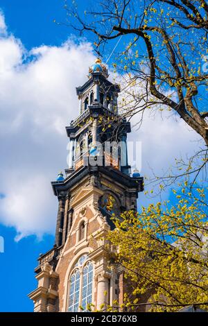 Low angle shot of traditional Amsterdam architecture under a cloudy sky in the Netherlands Stock Photo