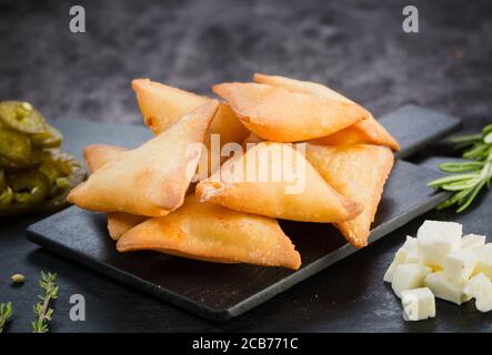 Homemade Samosas wiith Chutneys Diwali snacks, selective focus. jalapenos cheese samosa. Stock Photo