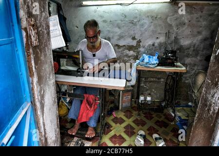 Bundi, India - August 2020: A tailor working in his small workshop in the old town of Bundi on August 10, 2020 in Bundi, Rajasthan. India Stock Photo