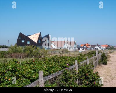 Houses and homes on the beach at Thorpness Suffolk UK Stock Photo